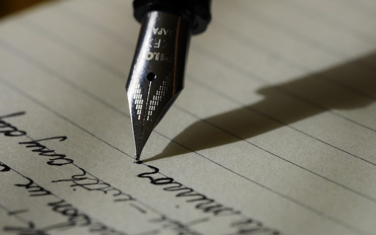 Writing a letter with fountain pen and stationery